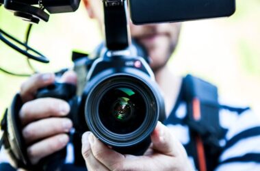 Person holding a camera | Photo by Terje Sollie