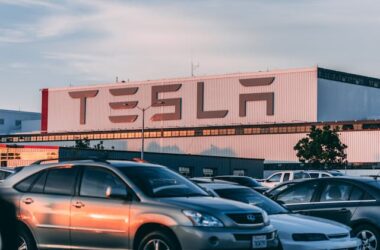 Cars parked in front of Tesla building | Photo by Craig Adderley from Pexels