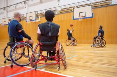 Men in wheelchairs playing basketball | Photo by Kampus Production