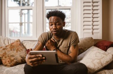 Man watching a video on a tablet | Photo by RDNE Stock project