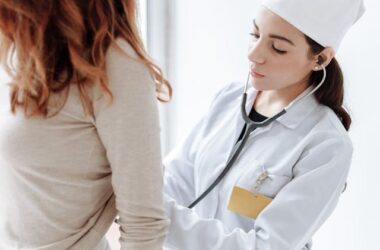 Doctor checking on a patient | Photo by Thirdman