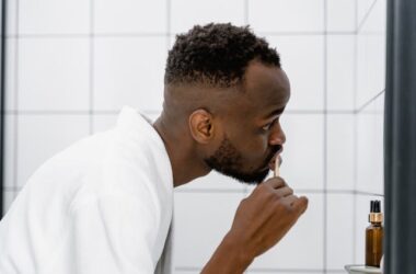 Person brushing their teeth | Photo by Tima Miroshnichenko