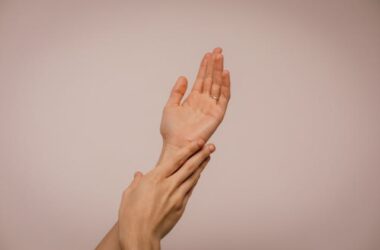 Person Touching Hand | Photo by Juan Pablo Serrano