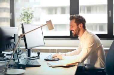 Man in White Dress Shirt Sitting on Black Rolling Chair While Facing Black Computer Set | Photo by Andrea Piacquadio