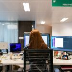 Woman Sitting in Front of Computer in Office | Photo by ThisIsEngineering