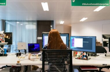 Woman Sitting in Front of Computer in Office | Photo by ThisIsEngineering